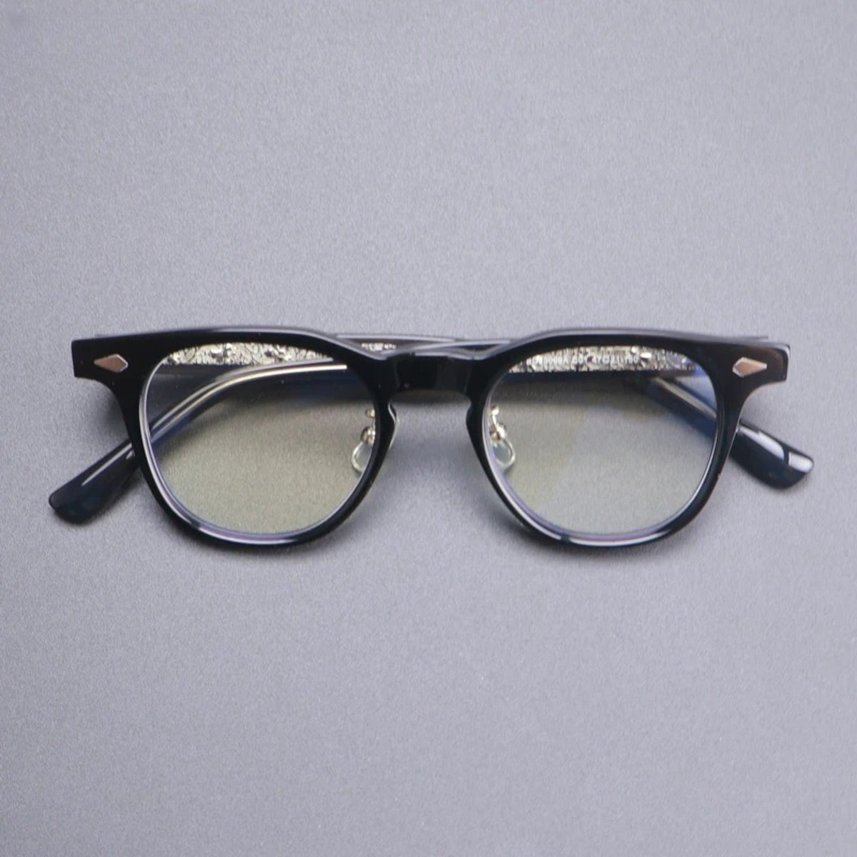 Gafas de acetato con puente de cerradura tipo panto