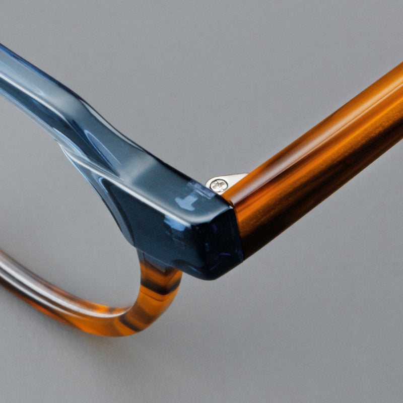 Monturas de gafas geométricas tipo browline de acetato con lentes redondeadas y borde superior angular