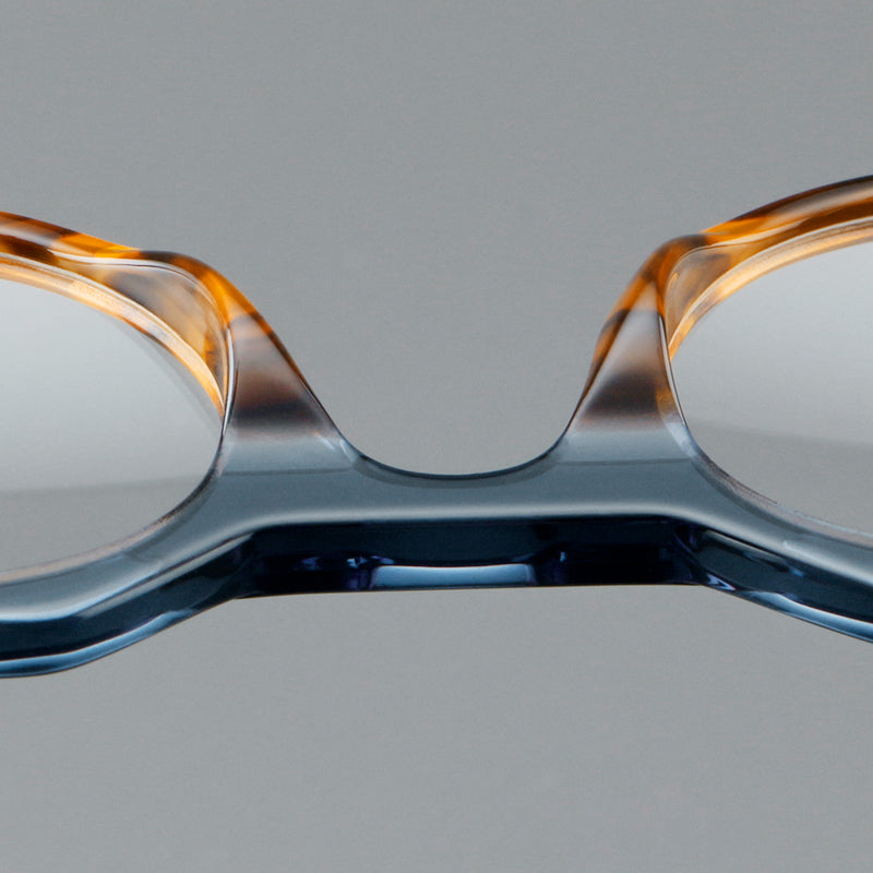 Monturas de gafas geométricas tipo browline de acetato con lentes redondeadas y borde superior angular