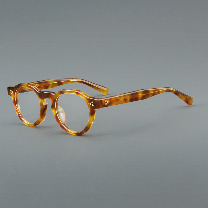 Montura de gafas vintage redondas de acetato con puente de cerradura y detalle de tres remaches