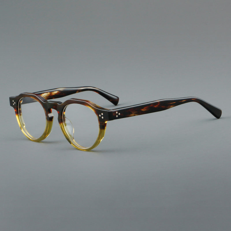 Montura de gafas vintage redondas de acetato con puente de cerradura y detalle de tres remaches