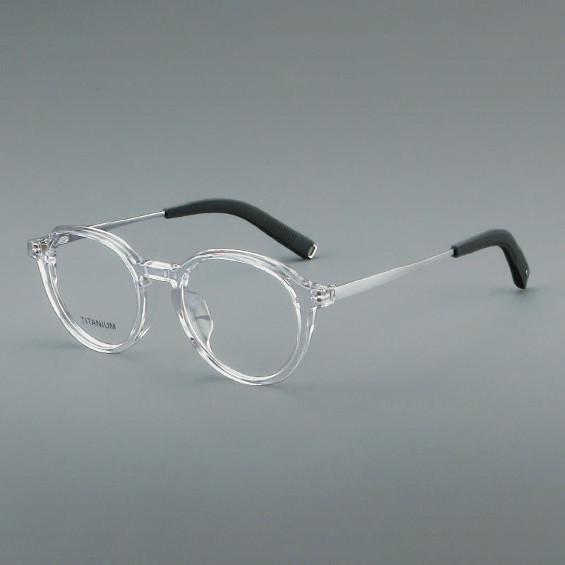 Monturas de gafas redondas de aleación de titanio con borde superior esculpido y puente metálico