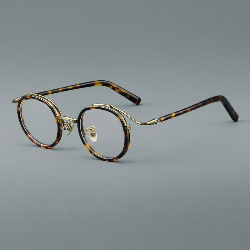 Montura de gafas redondas retro de acetato con puente de metal fino y detalles laterales