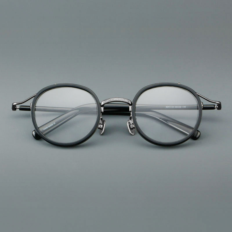 Montura de gafas redondas retro de acetato con puente de metal fino y detalles laterales
