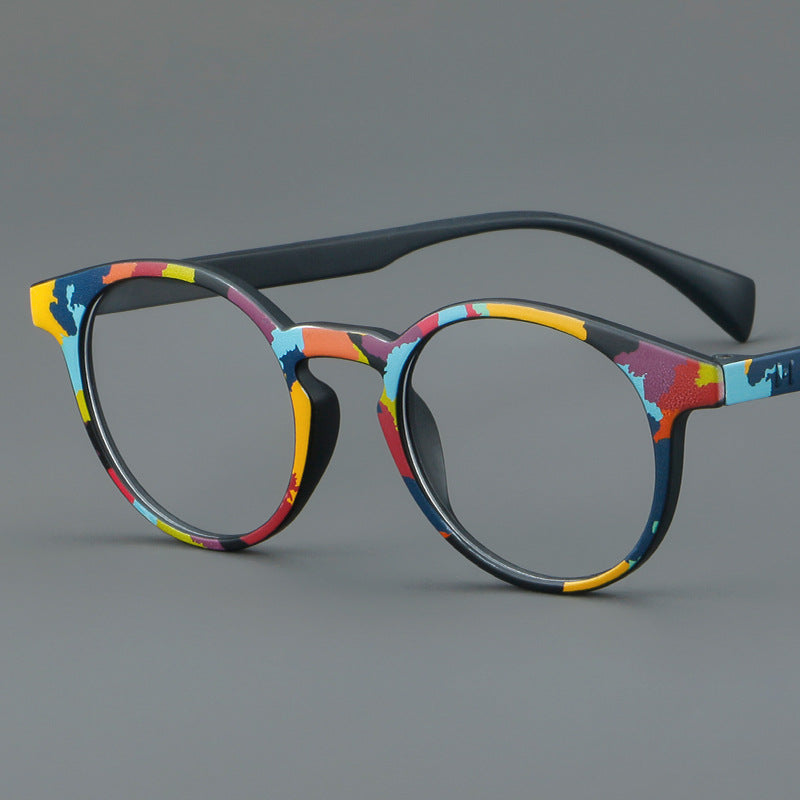 Monturas de gafas estilo ojo de gato pintadas con patrones multicolores y esquinas elevadas