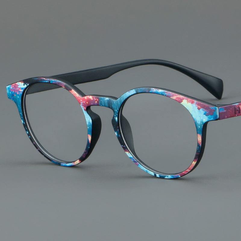Monturas de gafas estilo ojo de gato pintadas con patrones multicolores y esquinas elevadas