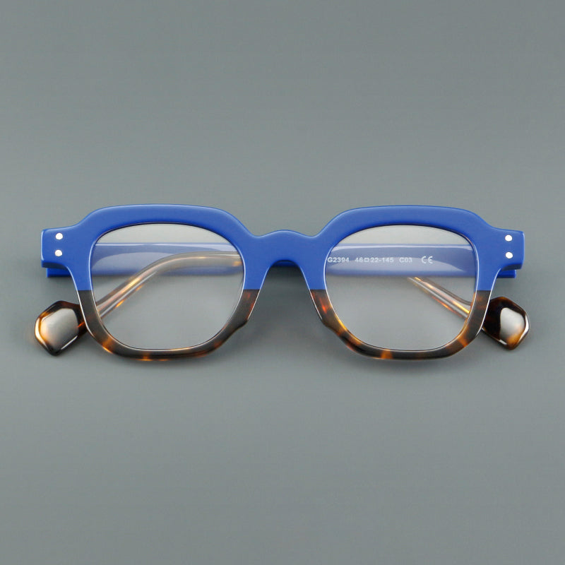 Monturas de gafas geométricas cuadradas de acetato con línea superior escalonada y detalles de remaches