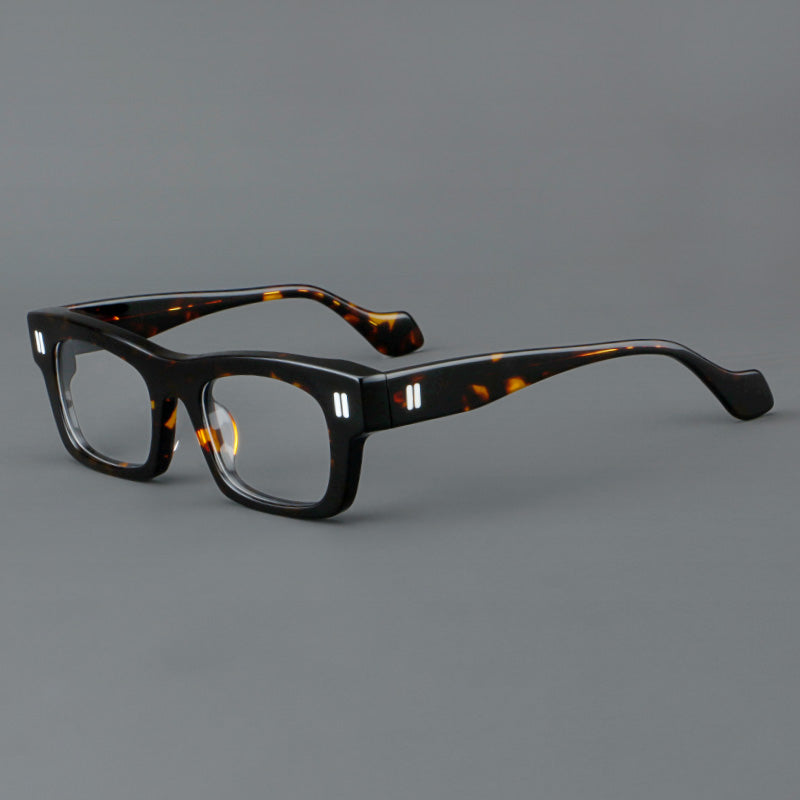 Monturas de gafas retro rectangulares de acetato con cejas gruesas y detalles de doble barra en las esquinas