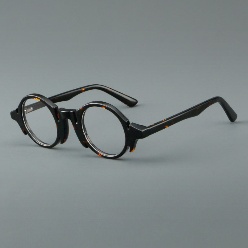Montura de gafas redondas de acetato con efecto de madera, frente esculpido y patillas moldeadas