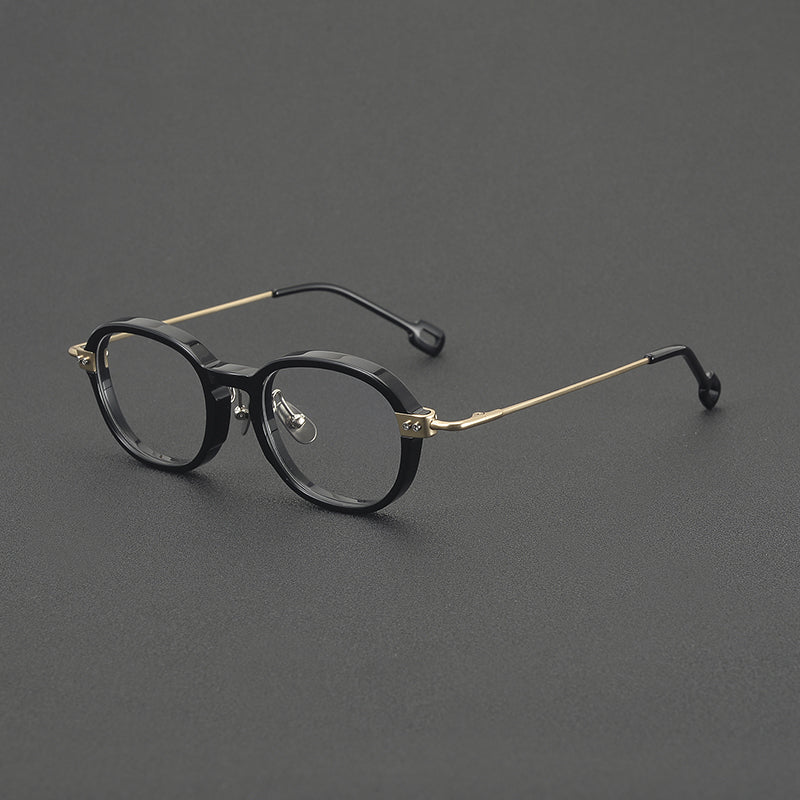 Monturas de gafas redondas retro de aleación de titanio con línea de cejas curva y detalles laterales de metal