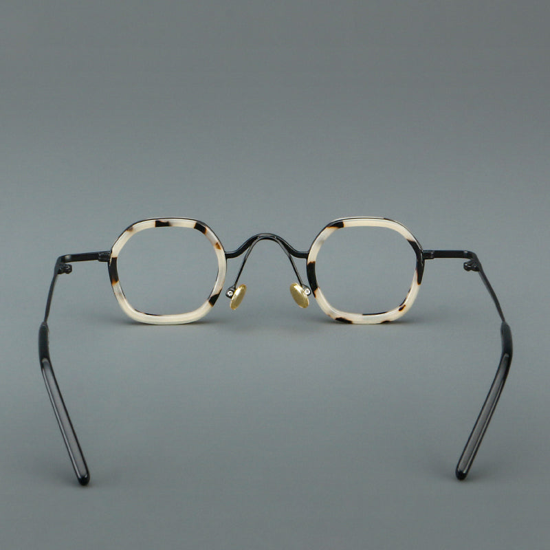 Monturas de gafas redondas geométricas vintage con puente arqueado elevado y almohadillas nasales