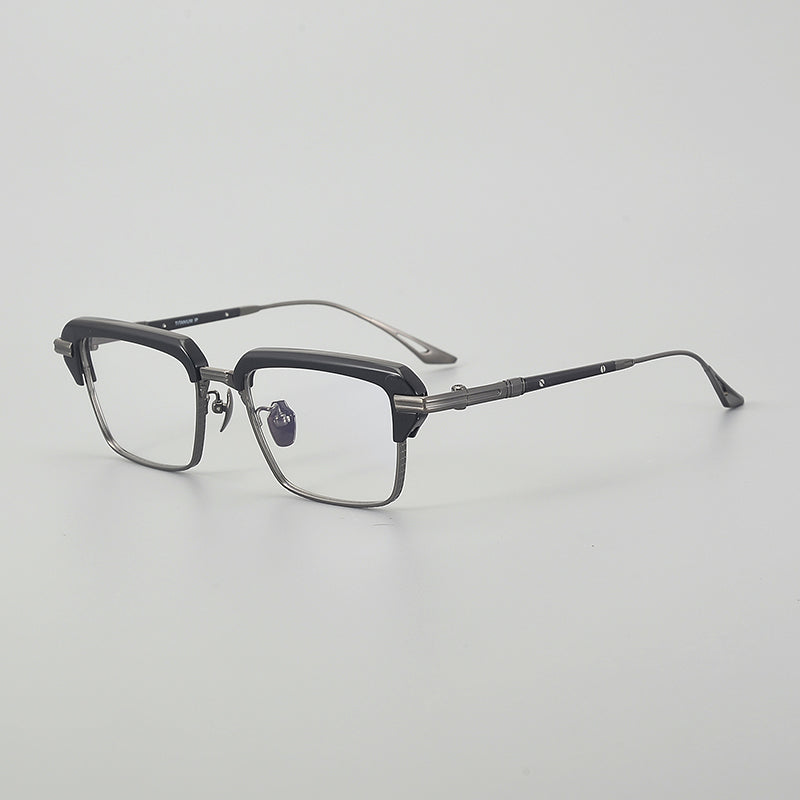 Monturas de gafas rectangulares vintage de titanio con línea superior definida y bordes inferiores de metal fino