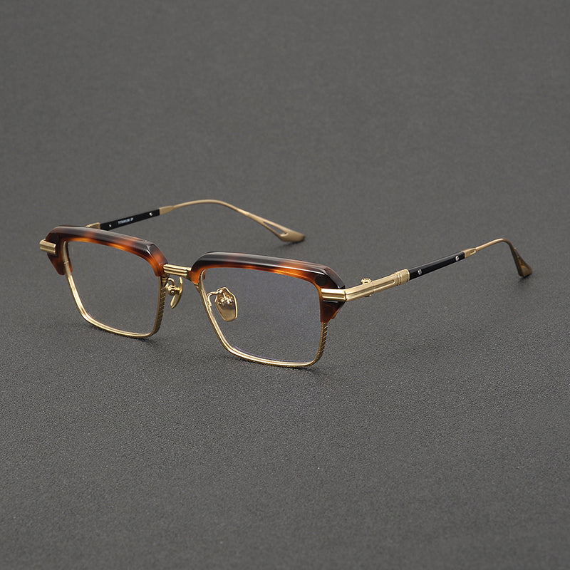 Monturas de gafas rectangulares vintage de titanio con línea superior definida y bordes inferiores de metal fino