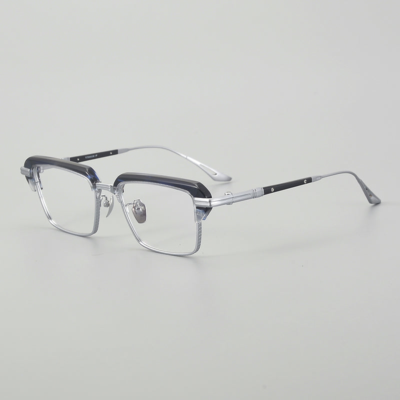 Monturas de gafas rectangulares vintage de titanio con línea superior definida y bordes inferiores de metal fino