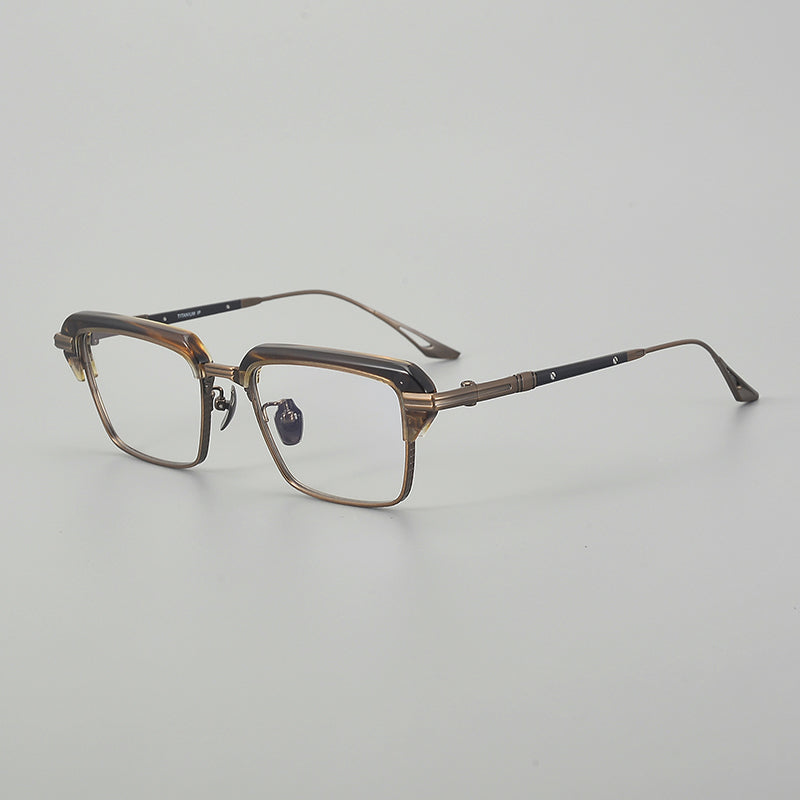 Monturas de gafas rectangulares vintage de titanio con línea superior definida y bordes inferiores de metal fino
