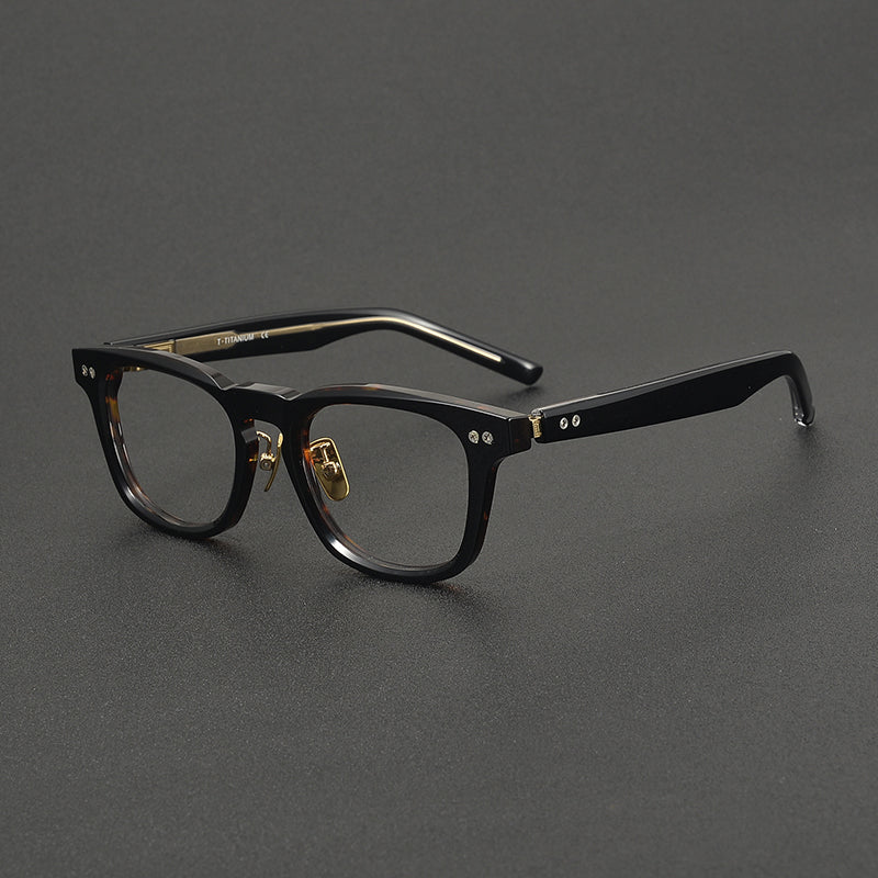 Monturas de gafas clásicas cuadradas de acetato con detalle de remaches en el frente y varillas anchas