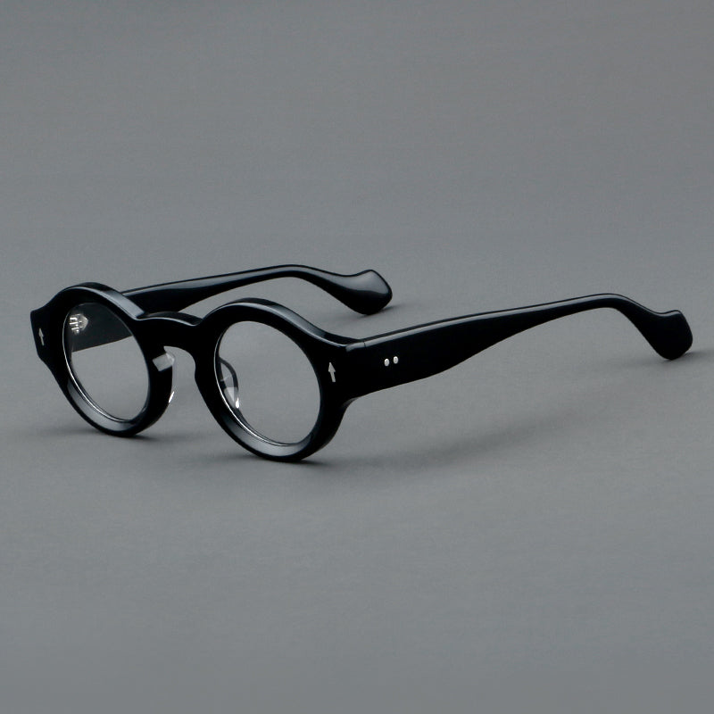 Monturas de gafas retro redondas de acetato, bordes circulares gruesos y detalles laterales esculpidos