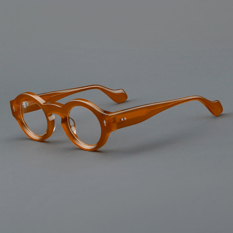 Monturas de gafas retro redondas de acetato, bordes circulares gruesos y detalles laterales esculpidos