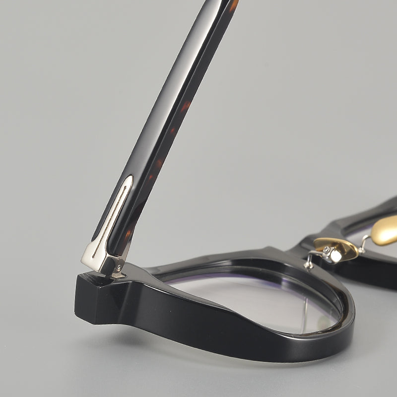 Monturas de gafas redondas de acetato con esquinas superiores definidas y almohadillas nasales