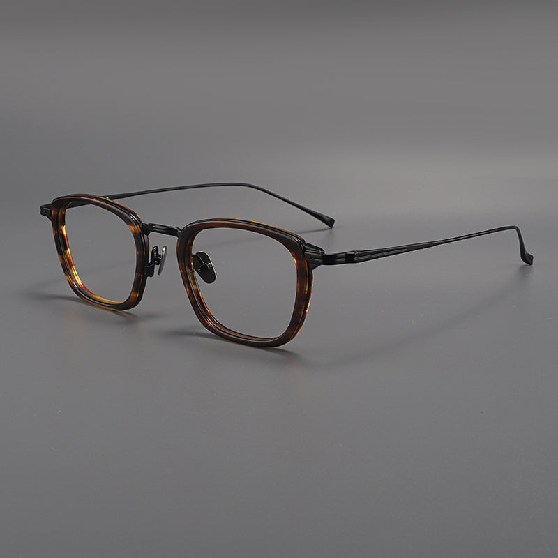 Monturas de gafas rectangulares de titanio con esquinas redondeadas y patillas de metal delgadas