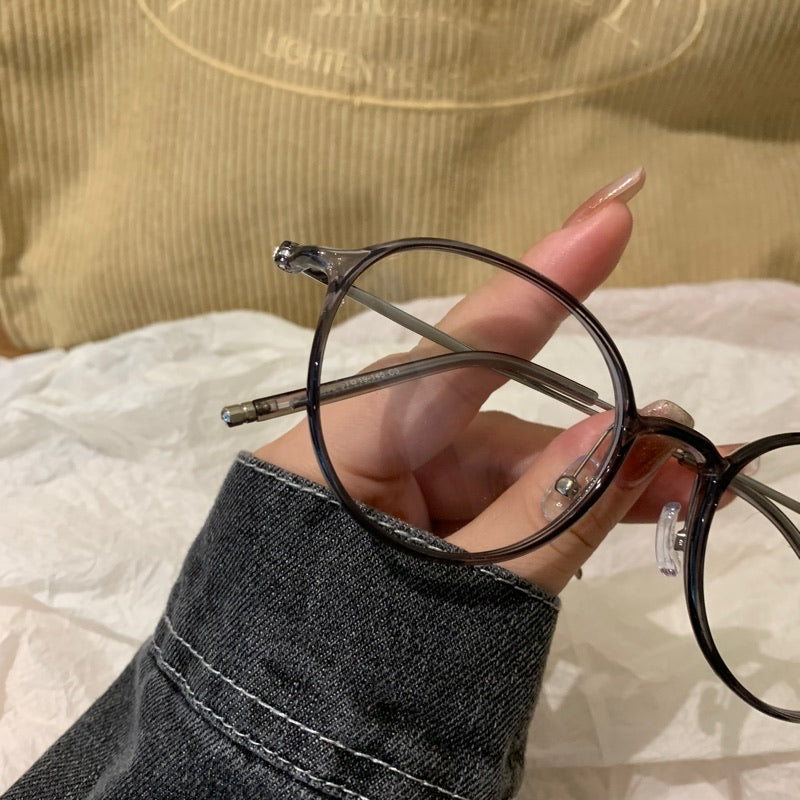 Monturas de gafas redondas con a ros finos, gris transparente o marrón té frío