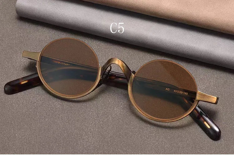 
Gafas de sol ovaladas retro polarizadas | Titanio puro | Marrón oscuro - Oro