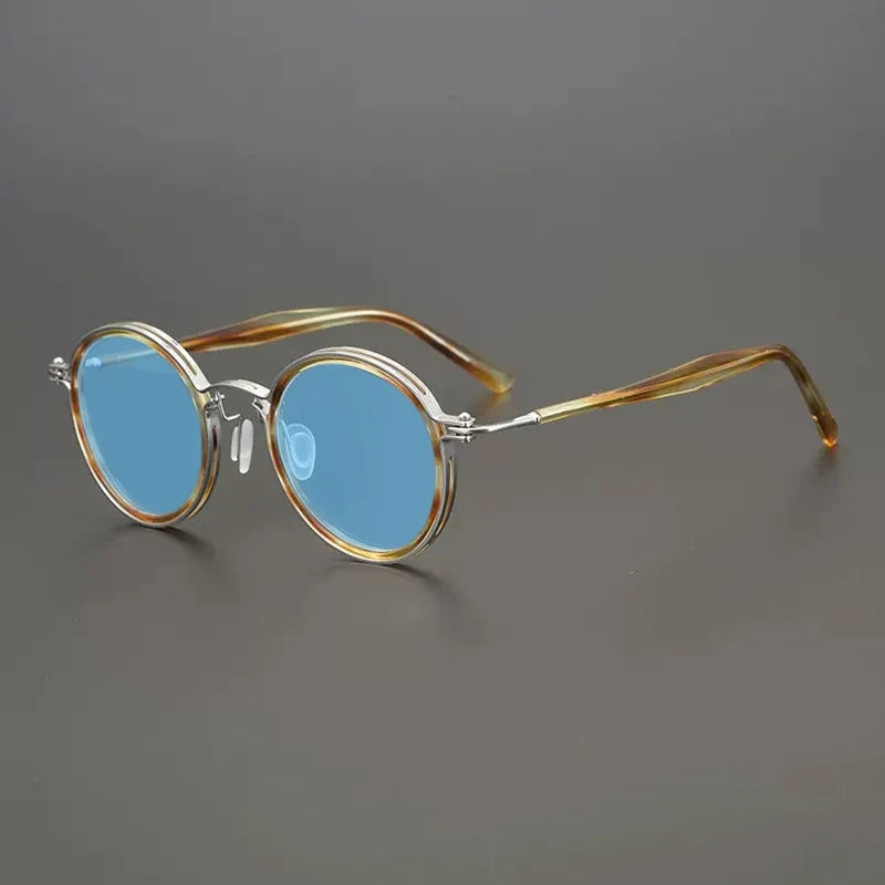 
Gafas de sol redondas vintage polarizadas con protección UV400 y detalle de titanio - Marrón
