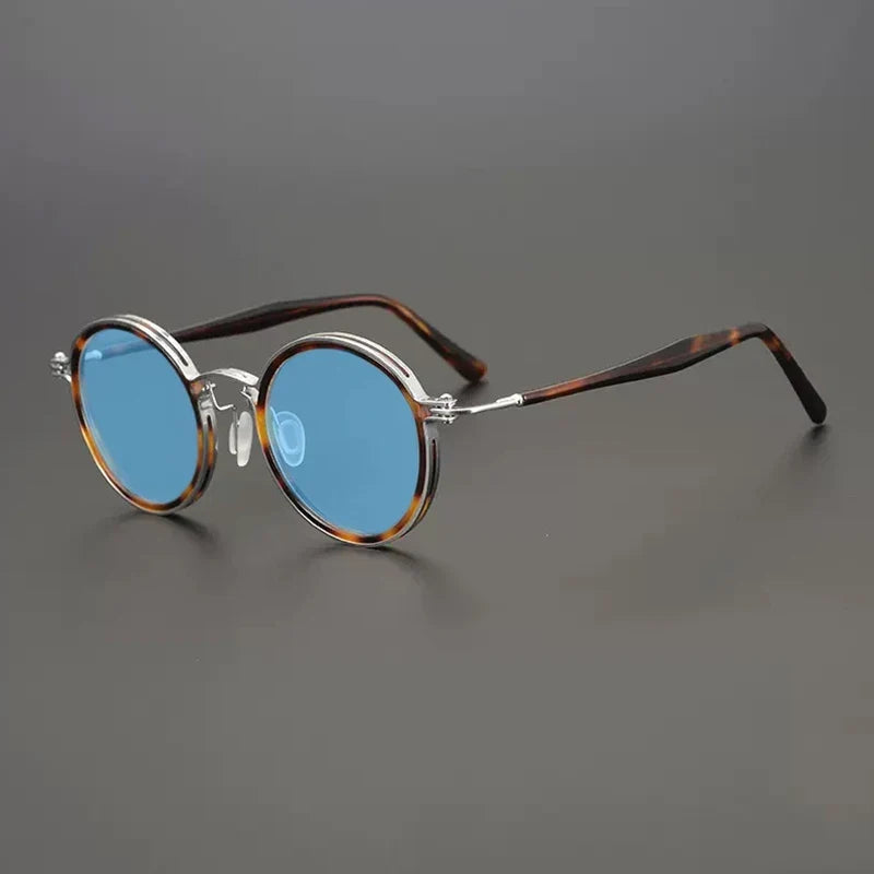 
Gafas de sol redondas vintage polarizadas con protección UV400 y detalle de titanio - Carey plateado