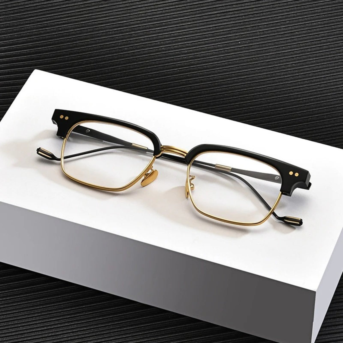 
Montura cuadrada de acetato transparente con medio aro