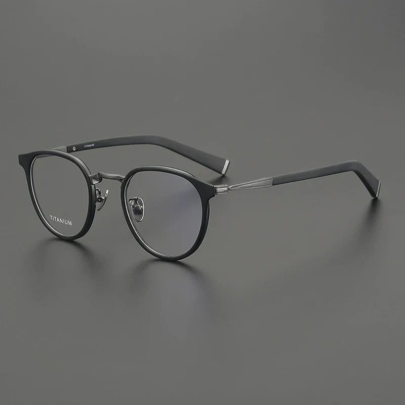 
Montura redonda de acetato y titanio - Negro