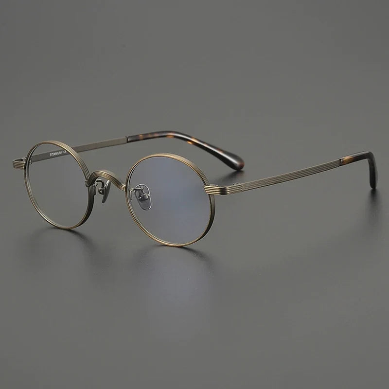 
Gafas redondas antiguas de titanio - Carey