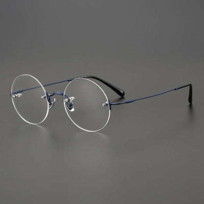 
Gafas redondas de titanio al aire