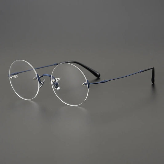 Gafas redondas de titanio al aire