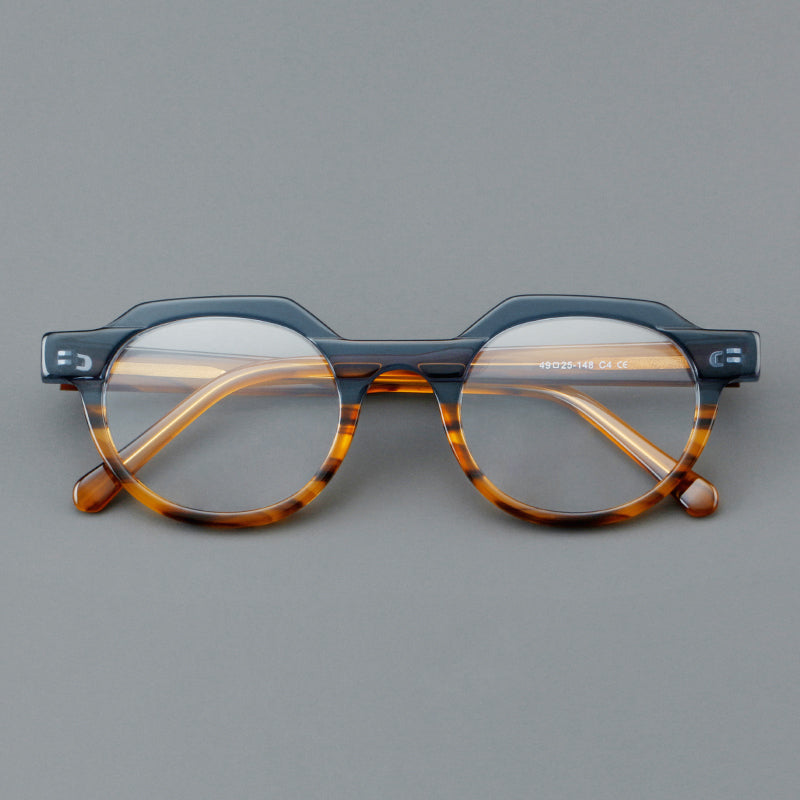 
Monturas de gafas geométricas tipo browline de acetato con lentes redondeadas y borde superior angular - Imagen 2