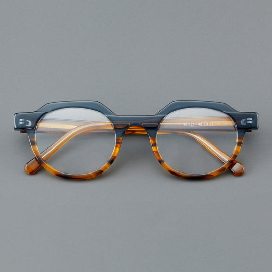 Monturas de gafas geométricas tipo browline de acetato con lentes redondeadas y borde superior angular