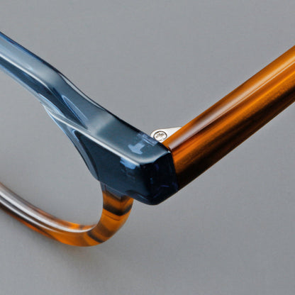 
Monturas de gafas geométricas tipo browline de acetato con lentes redondeadas y borde superior angular - Imagen 5