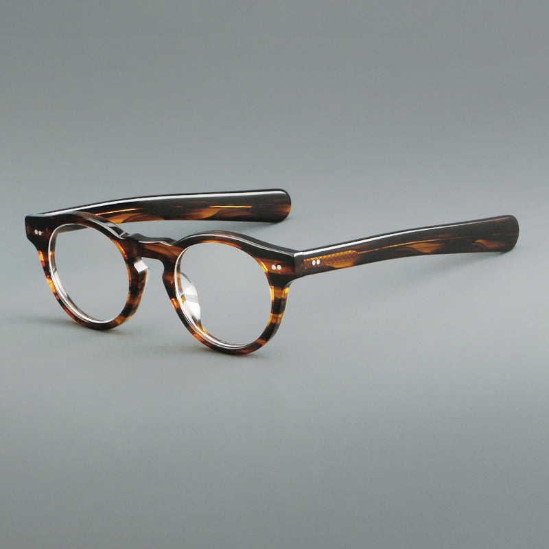 
Monturas de gafas redondas de acetato con aros gruesos y varillas anchas rectas