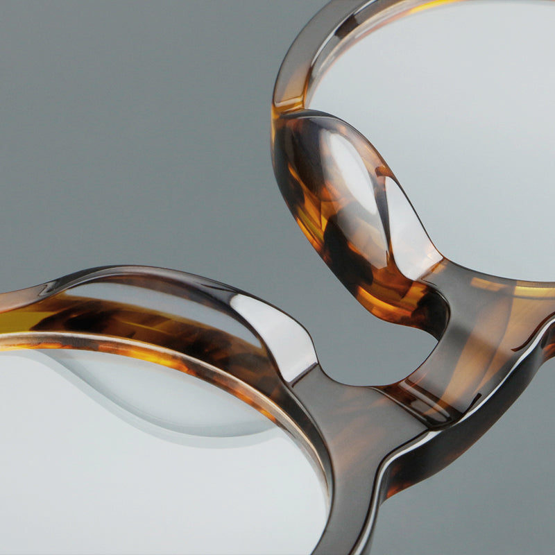 
Monturas de gafas redondas de acetato con aros gruesos y varillas anchas rectas