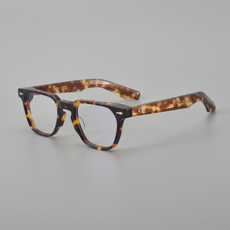 
Monturas de gafas retro rectangulares de acetato con esquinas redondeadas y detalles de remaches