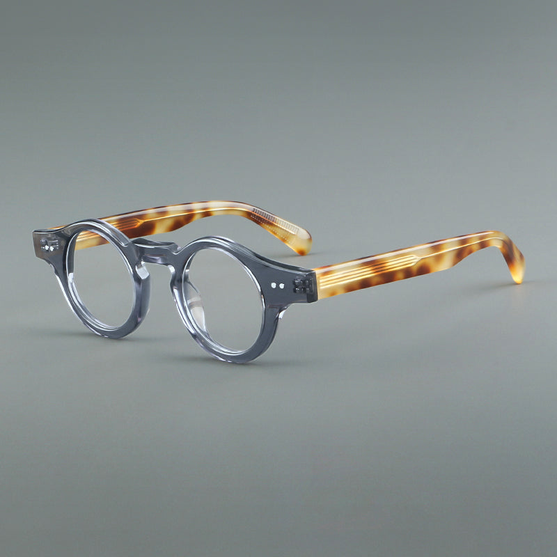 
Monturas de gafas geométricas redondas de acetato con esquinas angulares y detalle de remaches - Gris y Ámbar