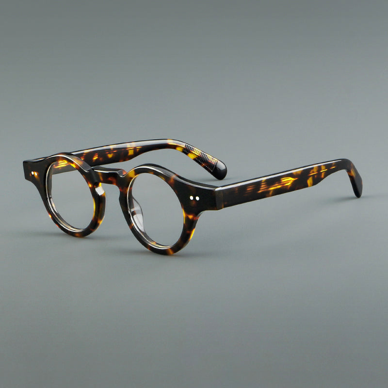 
Monturas de gafas geométricas redondas de acetato con esquinas angulares y detalle de remaches