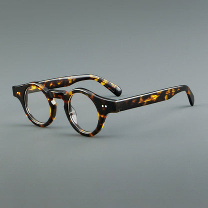 
Monturas de gafas geométricas redondas de acetato con esquinas angulares y detalle de remaches