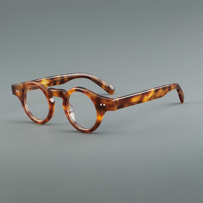 
Monturas de gafas geométricas redondas de acetato con esquinas angulares y detalle de remaches