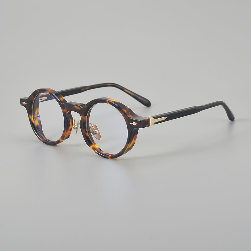 
Monturas de gafas retro de acetato estilo panto, con aros completos redondeados y almohadillas nasales