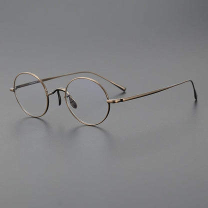 
Monturas de gafas redondas de titanio con aros de alambre fino y varillas metálicas delgadas - Imagen 6