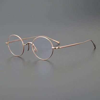 
Monturas de gafas redondas de titanio con aros de alambre fino y varillas metálicas delgadas - Imagen 8
