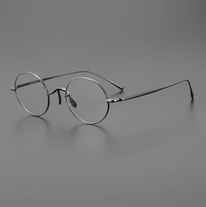
Monturas de gafas redondas de titanio con aros de alambre fino y varillas metálicas delgadas - Imagen 11