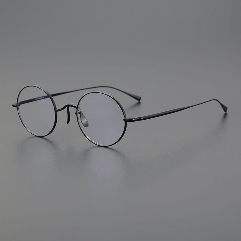 
Monturas de gafas redondas de titanio con aros de alambre fino y varillas metálicas delgadas - Imagen 13