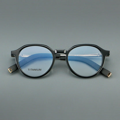 
Monturas de gafas redondas de aleación de titanio con borde superior esculpido y puente metálico - Imagen 3