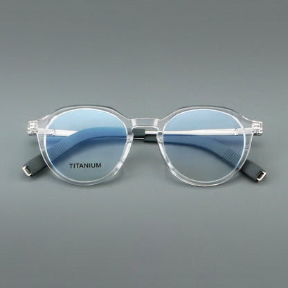 
Monturas de gafas redondas de aleación de titanio con borde superior esculpido y puente metálico - Imagen 5